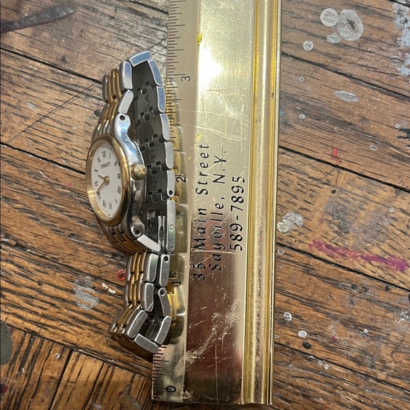 Tissot Gold and Silver Roman Numeral Watch women’s